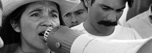 Dolores Huerta speaking through a megaphone